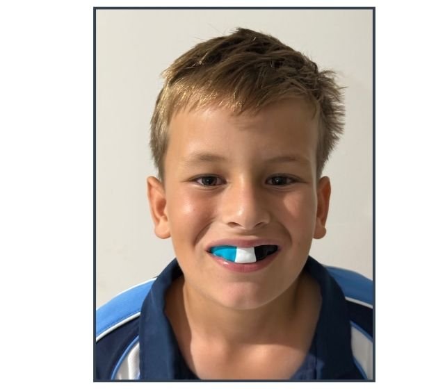 Young athlete wearing custom mouthguard
