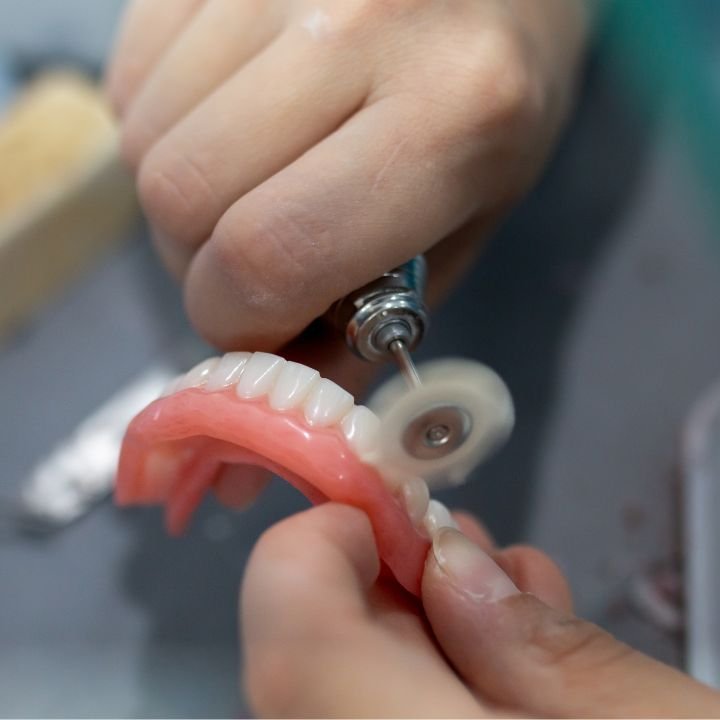 Hand-finishing a denture